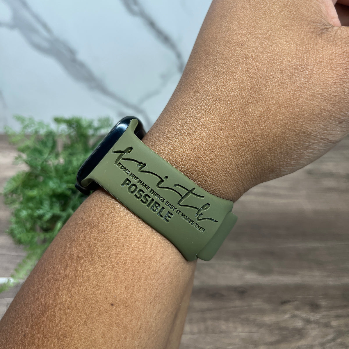 Olive green Faith Makes It Possible watch band for Apple Watch worn on a wrist, engraved with faith, it does not make things easy it makes them possible
