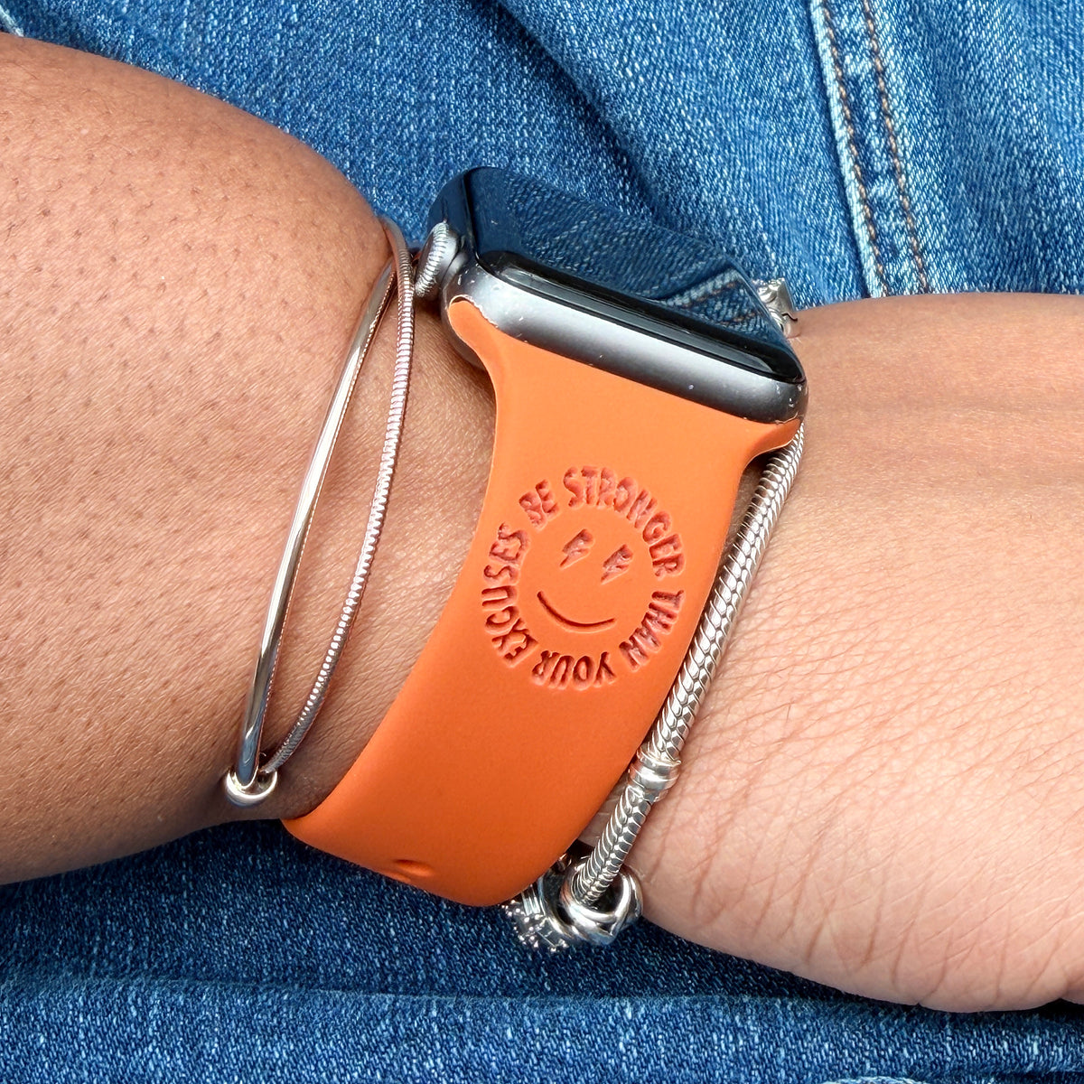 Be Stronger Than Your Excuses watch band for Apple Watch in rust, styled on a wrist