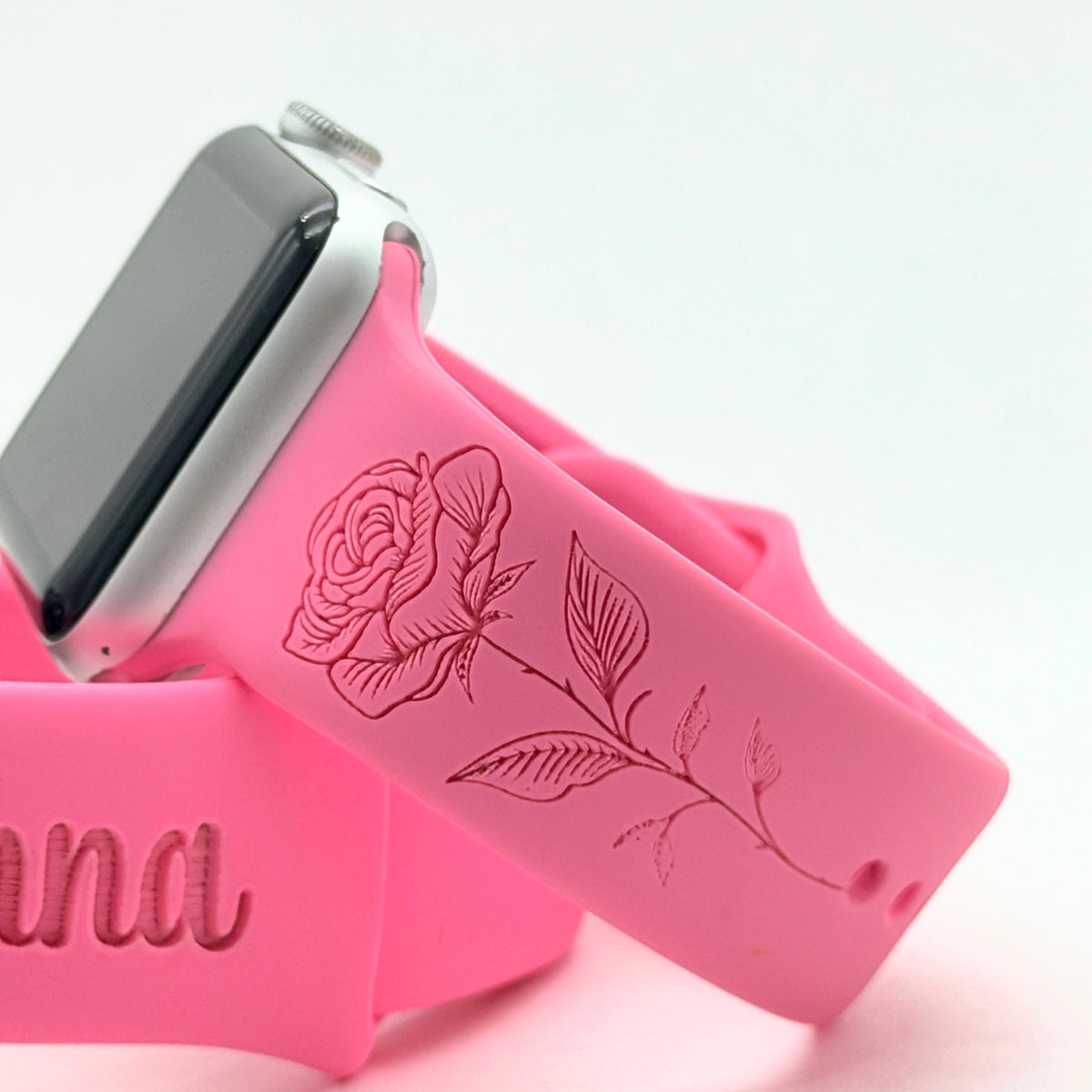 Close-up of the June Rose engraving on a pink Birth Month Flower watch band for Apple Watch