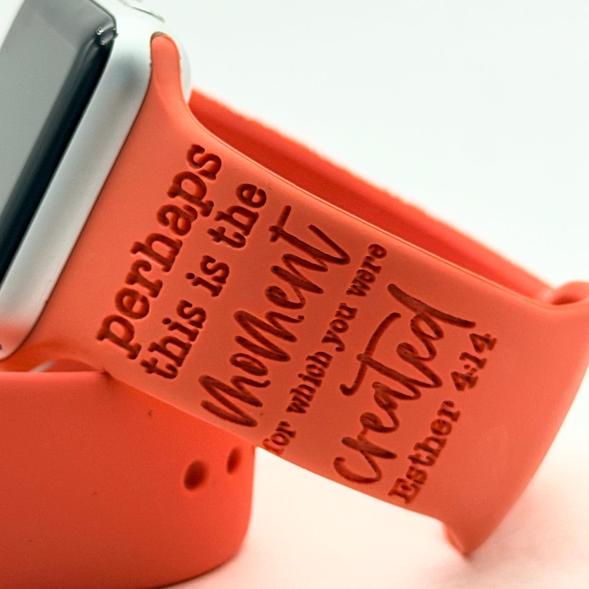 Engraving detail of the Esther 4:14 design on a coral silicone watch band for Apple Watch