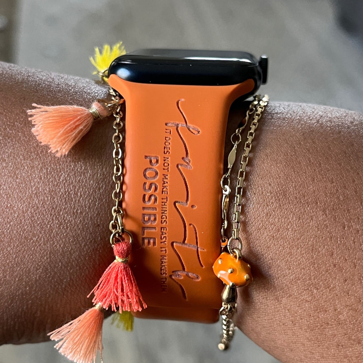 Rust Faith Makes It Possible watch band for Apple Watch worn with tassel bracelets