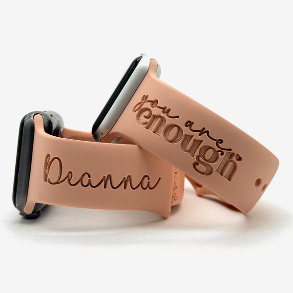 Blush I Am Enough watch band for Apple Watch engraved with the You Are Enough Script design, shown with a band engraved with the name Deanna