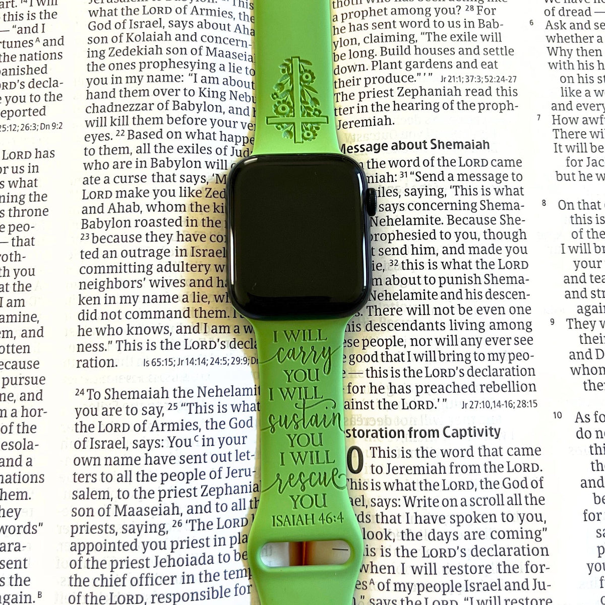 Green I Will Carry You watch band for Apple Watch laid on an open Bible