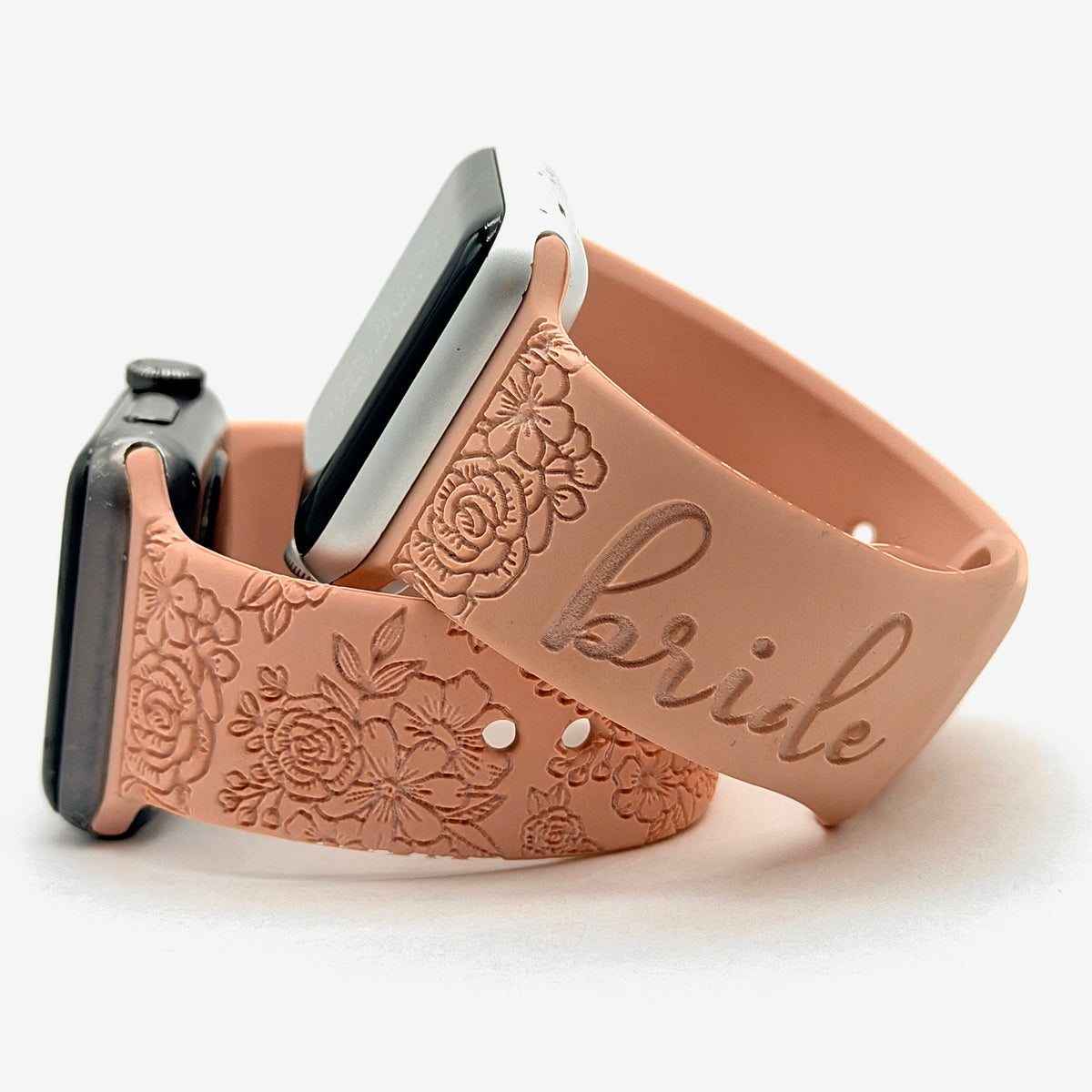 Blush personalized floral watch band for Apple Watch engraved with the word bride, shown with a matching floral engraved band