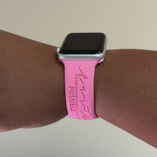 Pink Faith Makes It Possible watch band for Apple Watch worn on a wrist